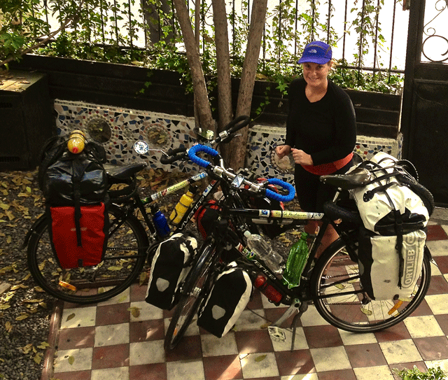 Mel stands by our newly "serviced" deathtraps before leaving Santiago